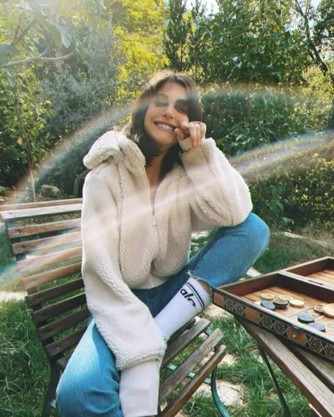 image by nouraridaofficial containing Outerwear, Sweater, Smile, Tree, Photography