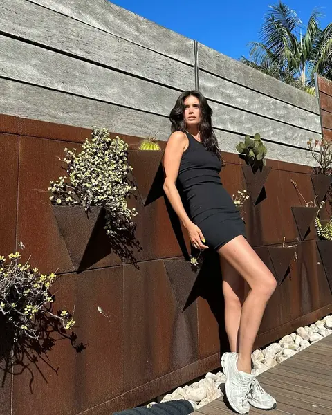 image by sarasampaio containing woman, dress, black, wall, pose
