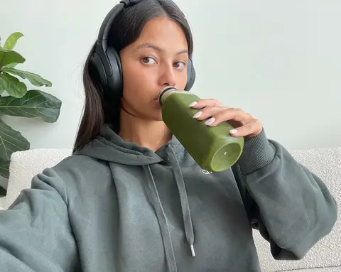 image by fiona.bl containing woman, earphone, green, drink, wear