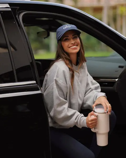 image by antonelaroccuzzo containing woman, car, sit, smile, cup