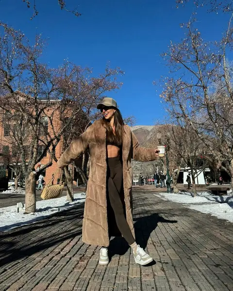 image by carolchafauzer containing woman, coat, stand, hat, wear