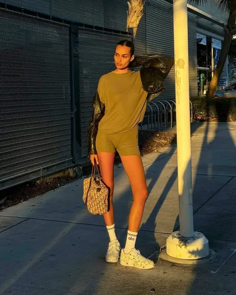 image by giizeleoliveira containing woman, stand, short, pavement, shoe