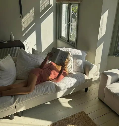 image by stephrobinnson containing couch, book, woman, lay, read