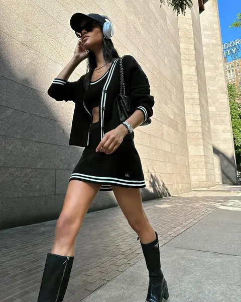 image by daianesodre containing woman, boot, black, earphone, dress