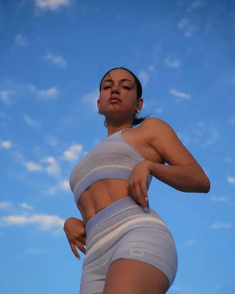 image by inanna containing woman, sky, blue, short, stand