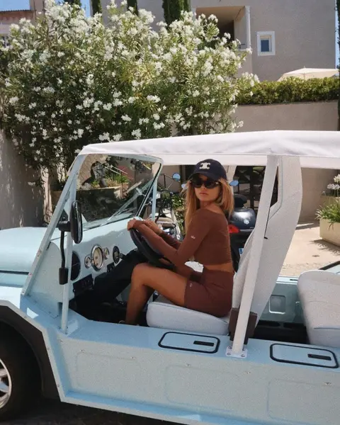 image by ericapelosini containing woman, sit, golf cart, goggles, white
