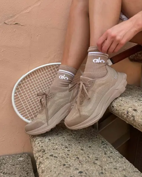 image by joycorrigan containing shoe, sit, tennis racket, person, woman