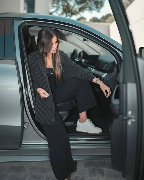 image by emiliafferrero containing woman, car, sit, door, open