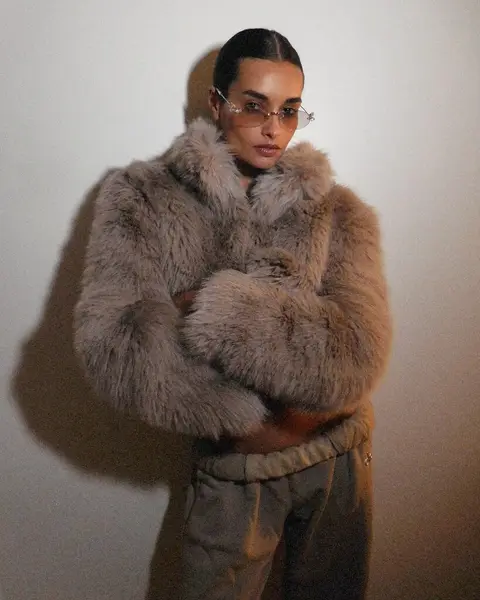 image by giizeleoliveira containing woman, fur coat, wear, cup, stand