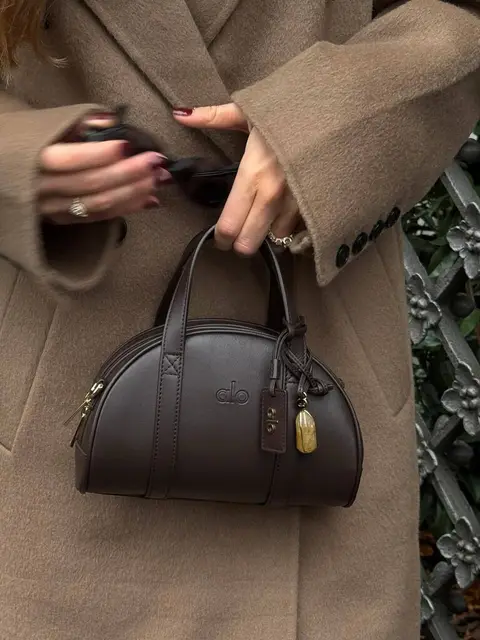 image by mathildegoehler containing woman, handbag, bag, coat, catch