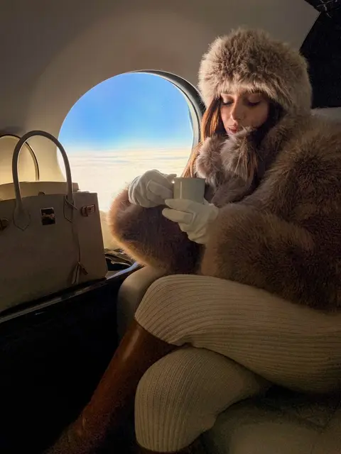 image by brunabiancardi containing woman, sit, plane, fur coat, seat