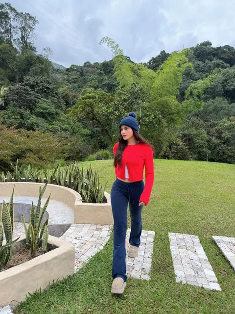 image by saraorrego containing woman, red, hat, sweater, blue