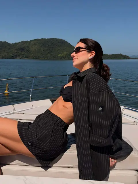 image by dudafournier containing woman, boat, sit, water, goggles